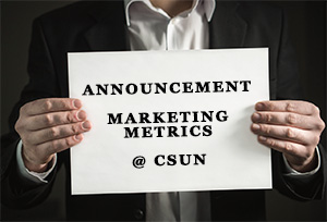 Announcement: Marketing Metrics @ CSUN. Image shows a person holding a piece of paper making an announcement. 